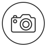 Symbolbild einer Kamera in minimalistischer Darstellung mit grauen Linien auf wei&szlig;em Hintergrund.